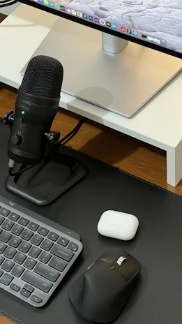 Close-up of sleek black and silver professional equipment arranged neatly on a modern workspace.