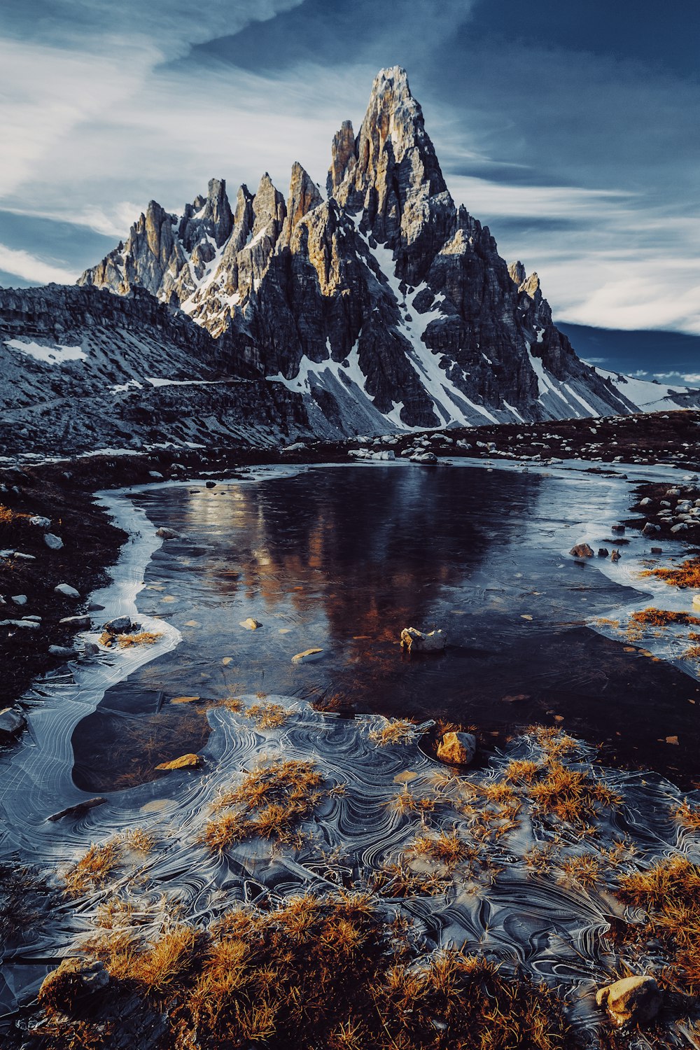 a large waterfall over a body of water