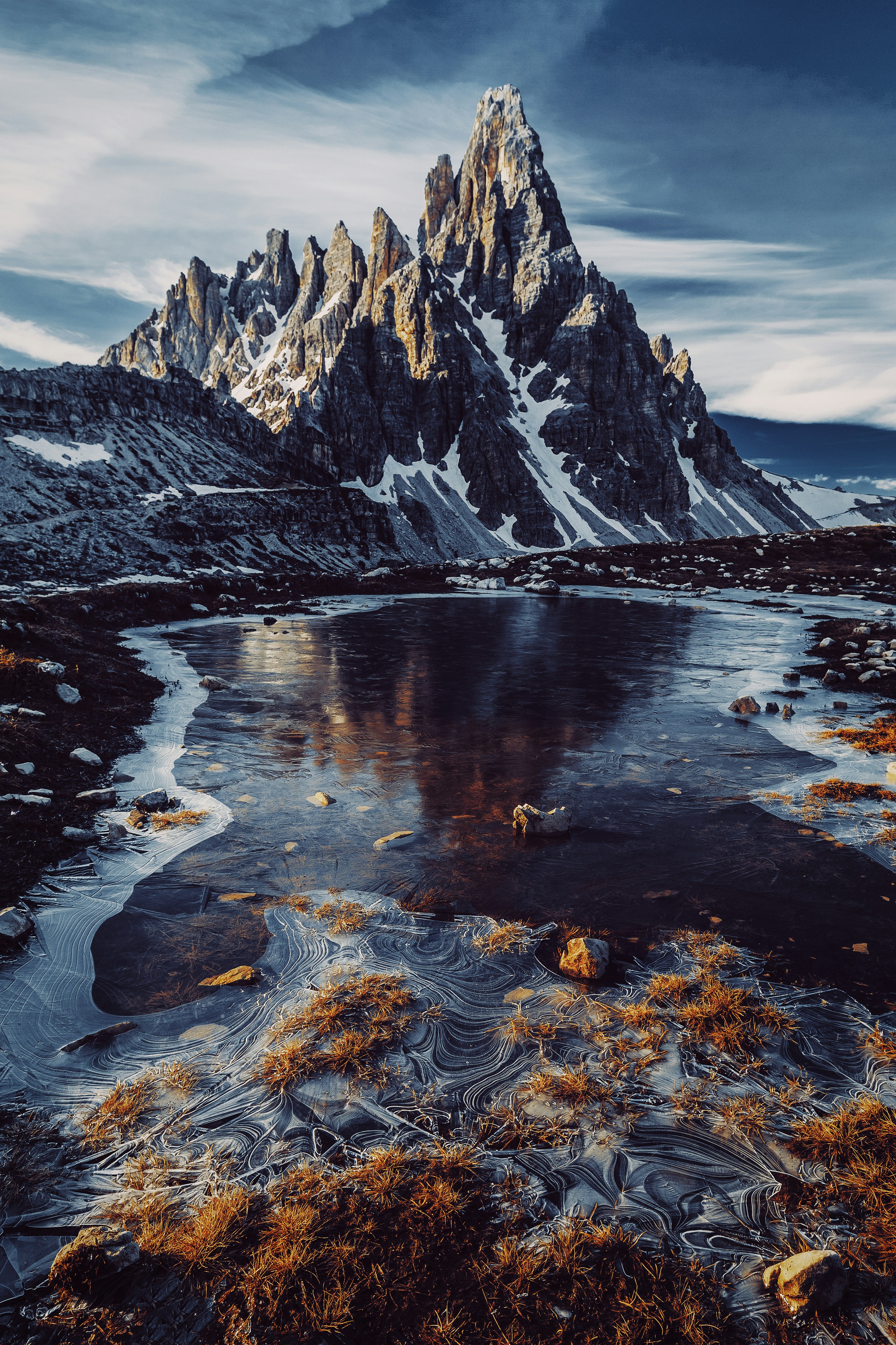 great photo recipe,how to photograph peak paternkofel.; a large waterfall over a body of water