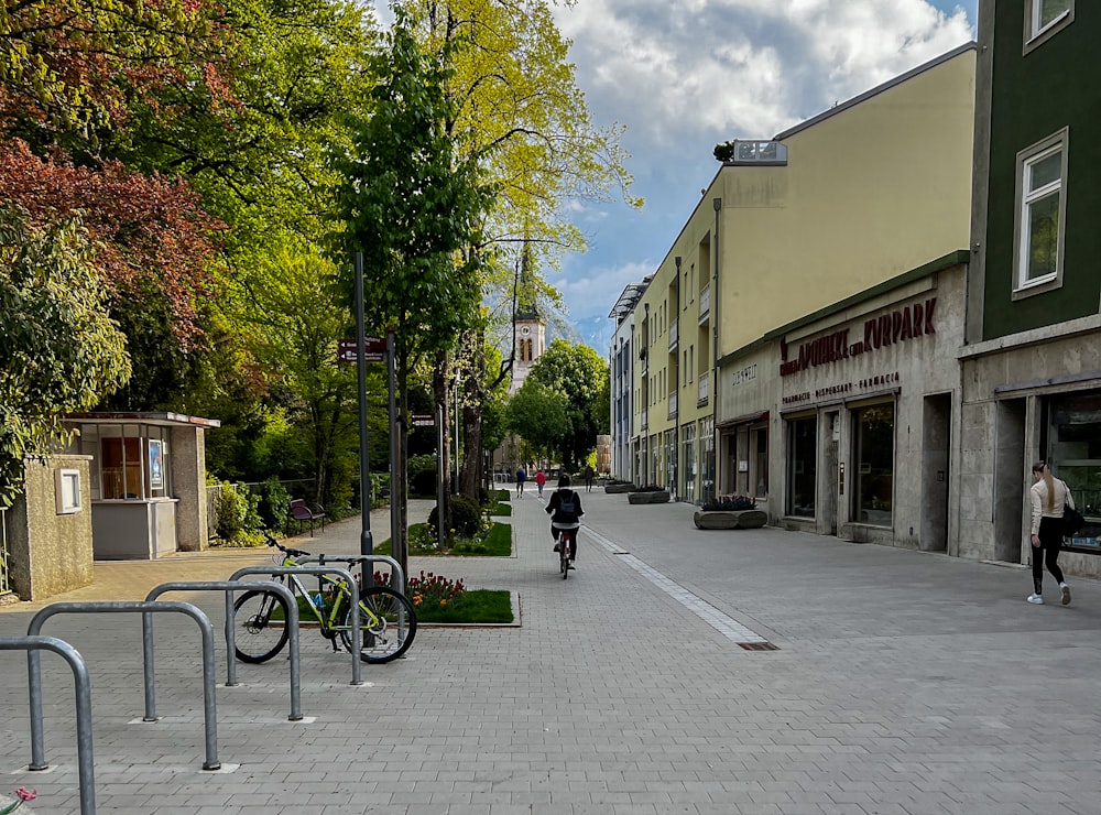 a person riding a bicycle on a street