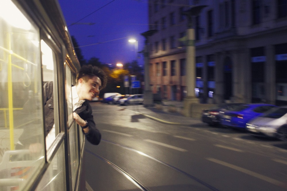 a person leaning on a window