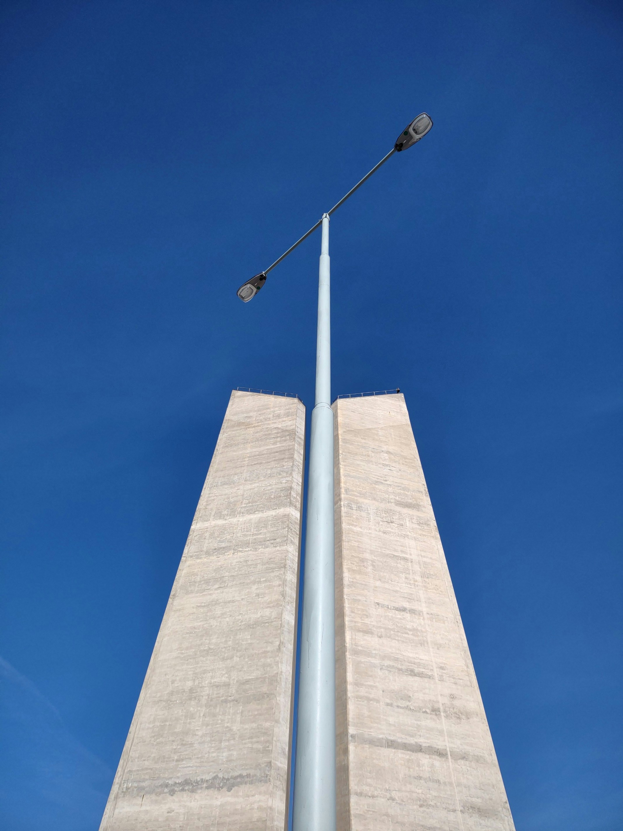 a tall tower with a lamp post