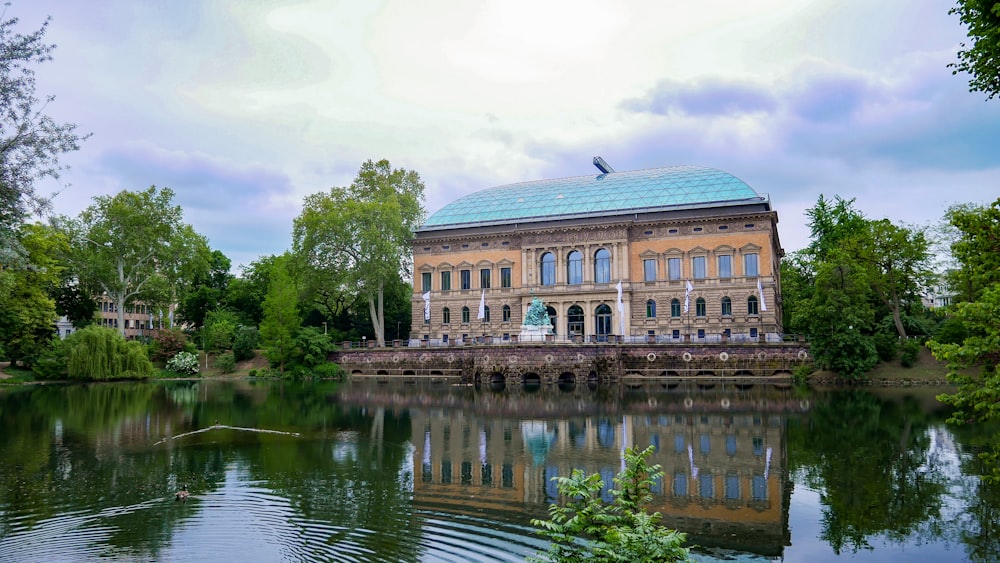 a building with a pond in front of it