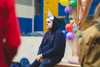 Clown family entertaining children at a colorful birthday party.