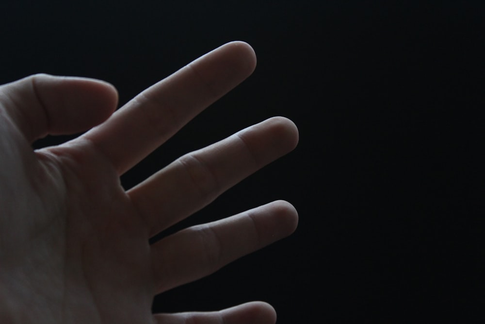 a hand with a black background