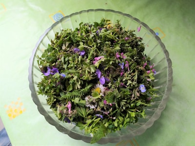 A close-up of fresh herbs and flowers arranged beautifully.