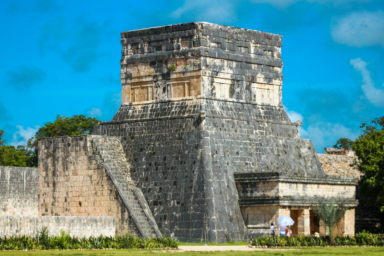 Stone temple with a stepped base beside the ball court at Chichen Itza, reachable from both Merida and Valladolid