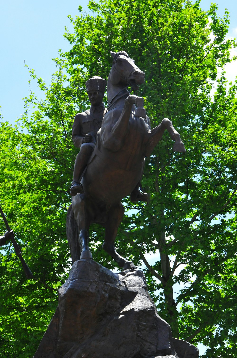 a statue of a man riding a horse