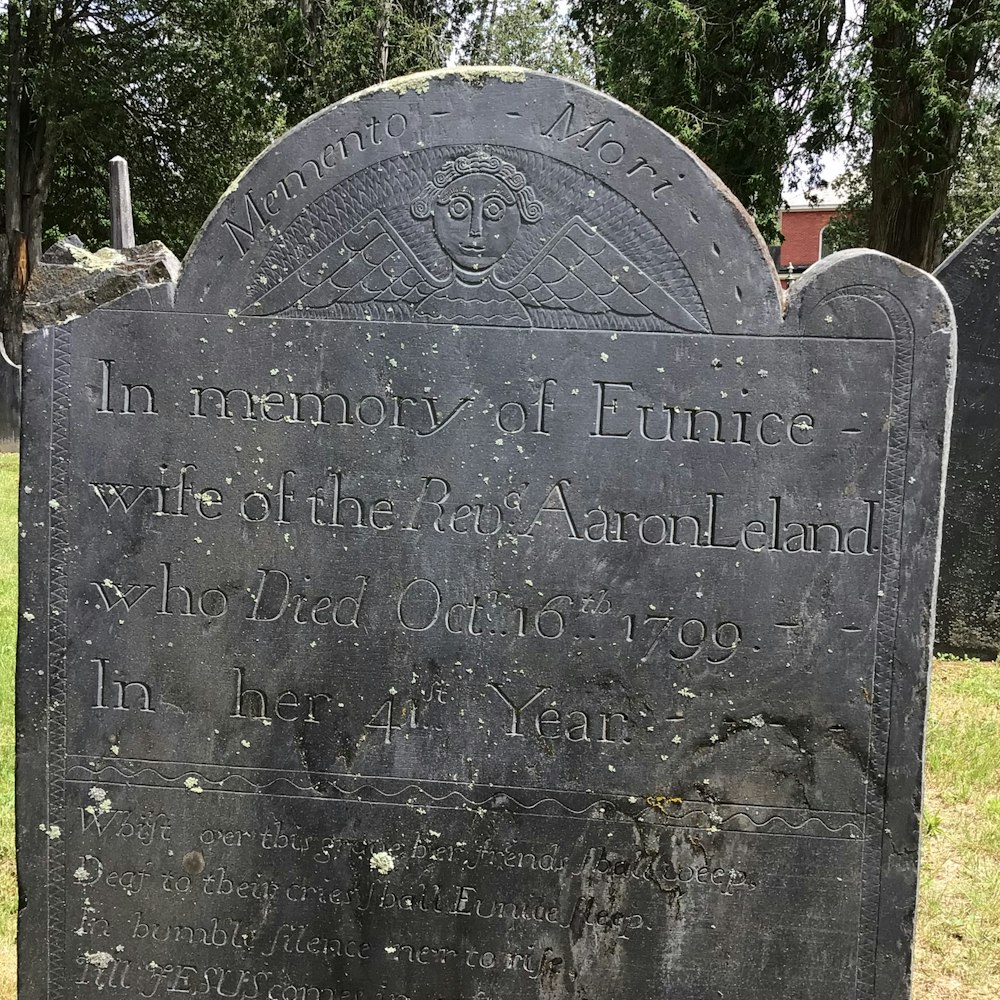a tombstone with writing on it