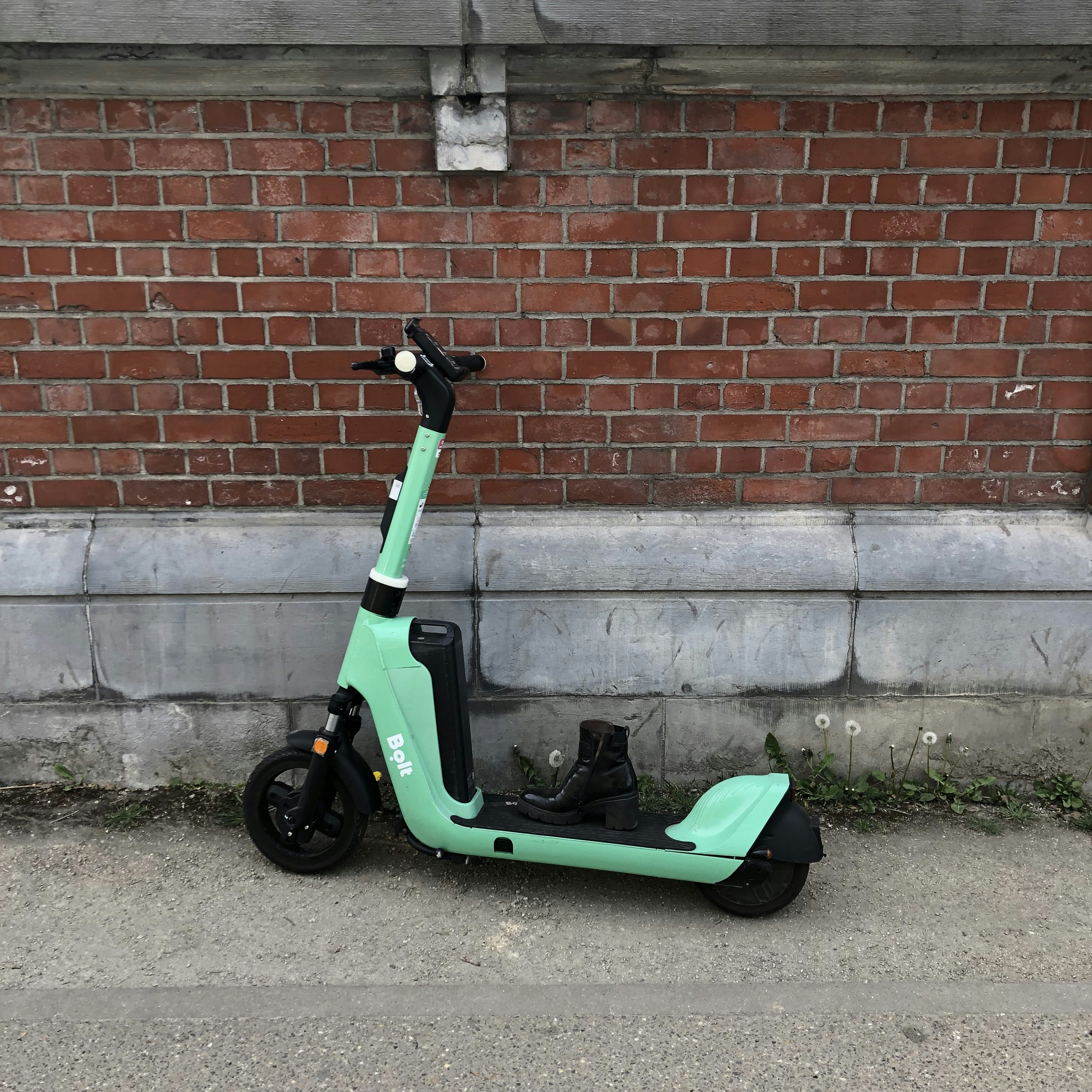 a moped parked on the side of a road
