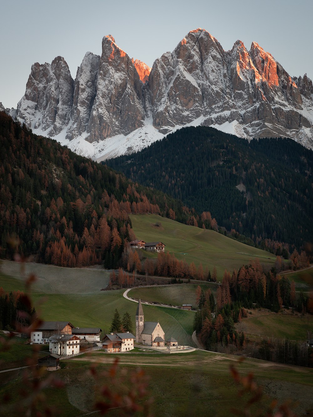 a small town in front of a mountain