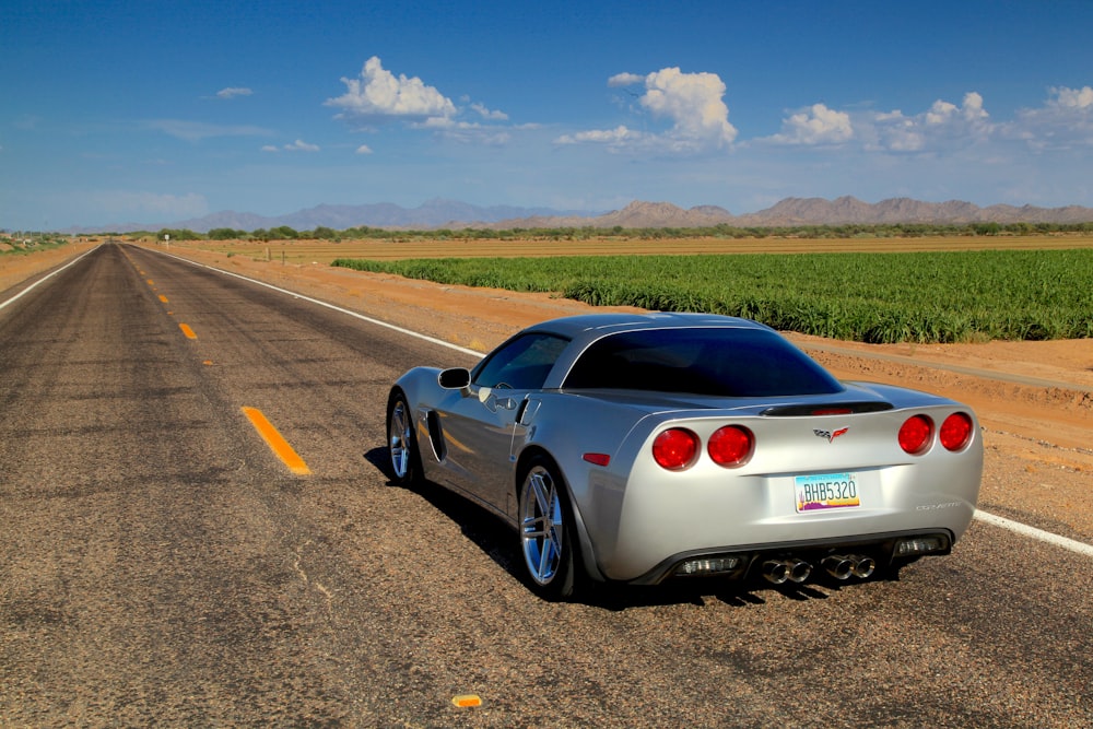 a white sports car on a road