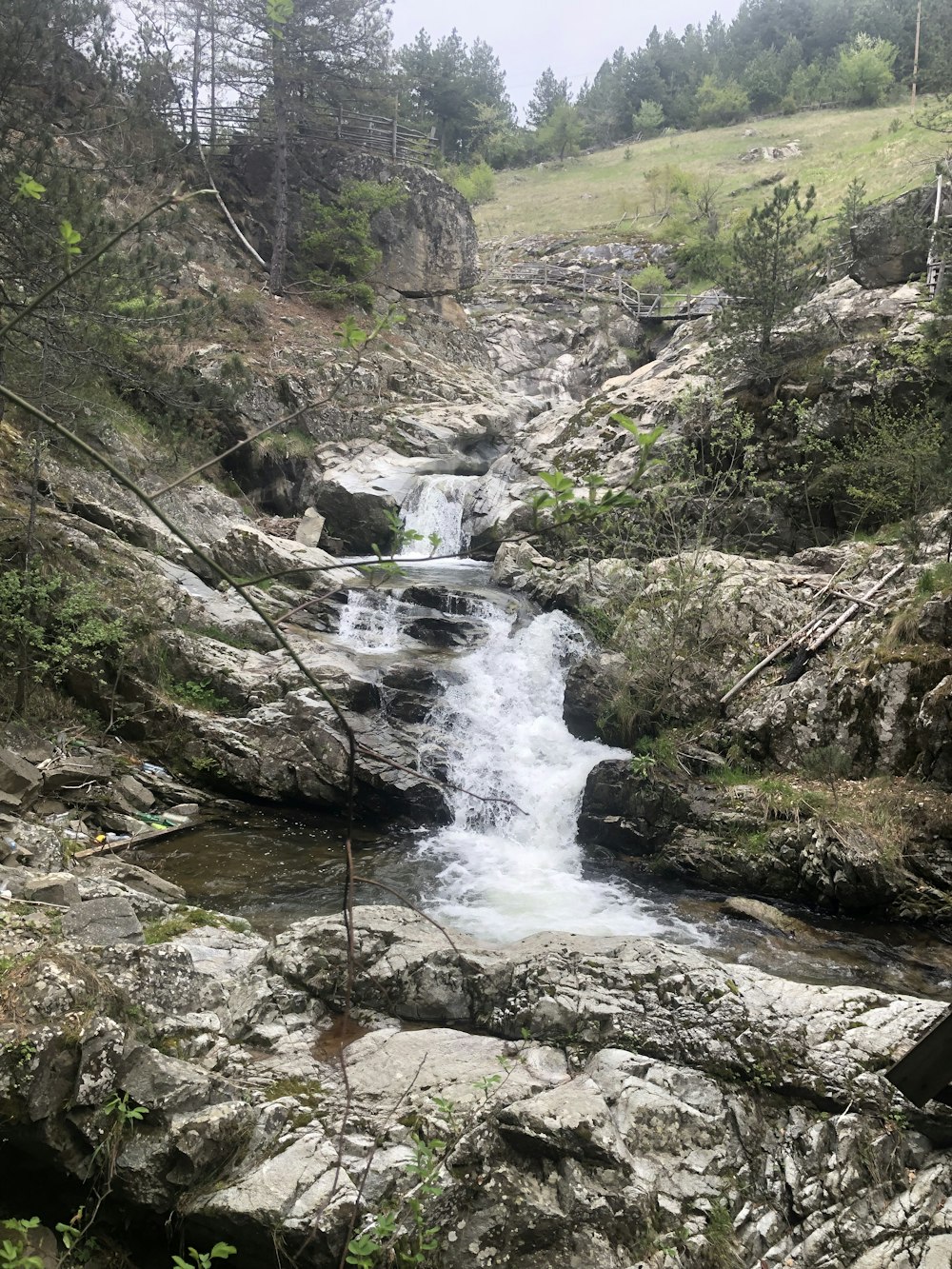 a small waterfall in a rocky area