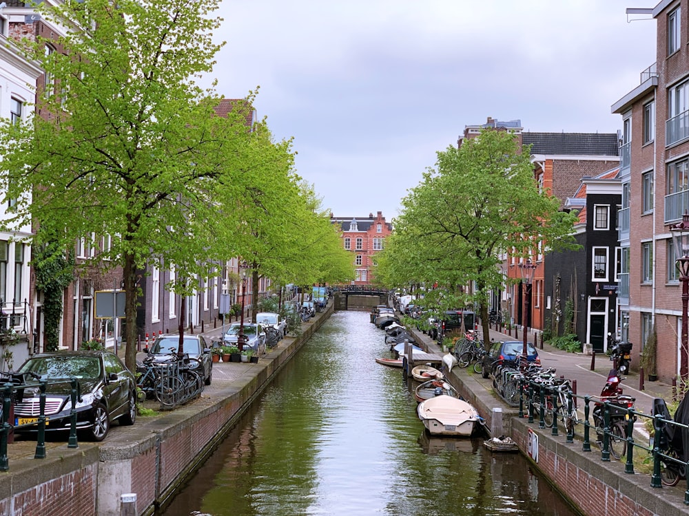 a canal with boats and buildings along it