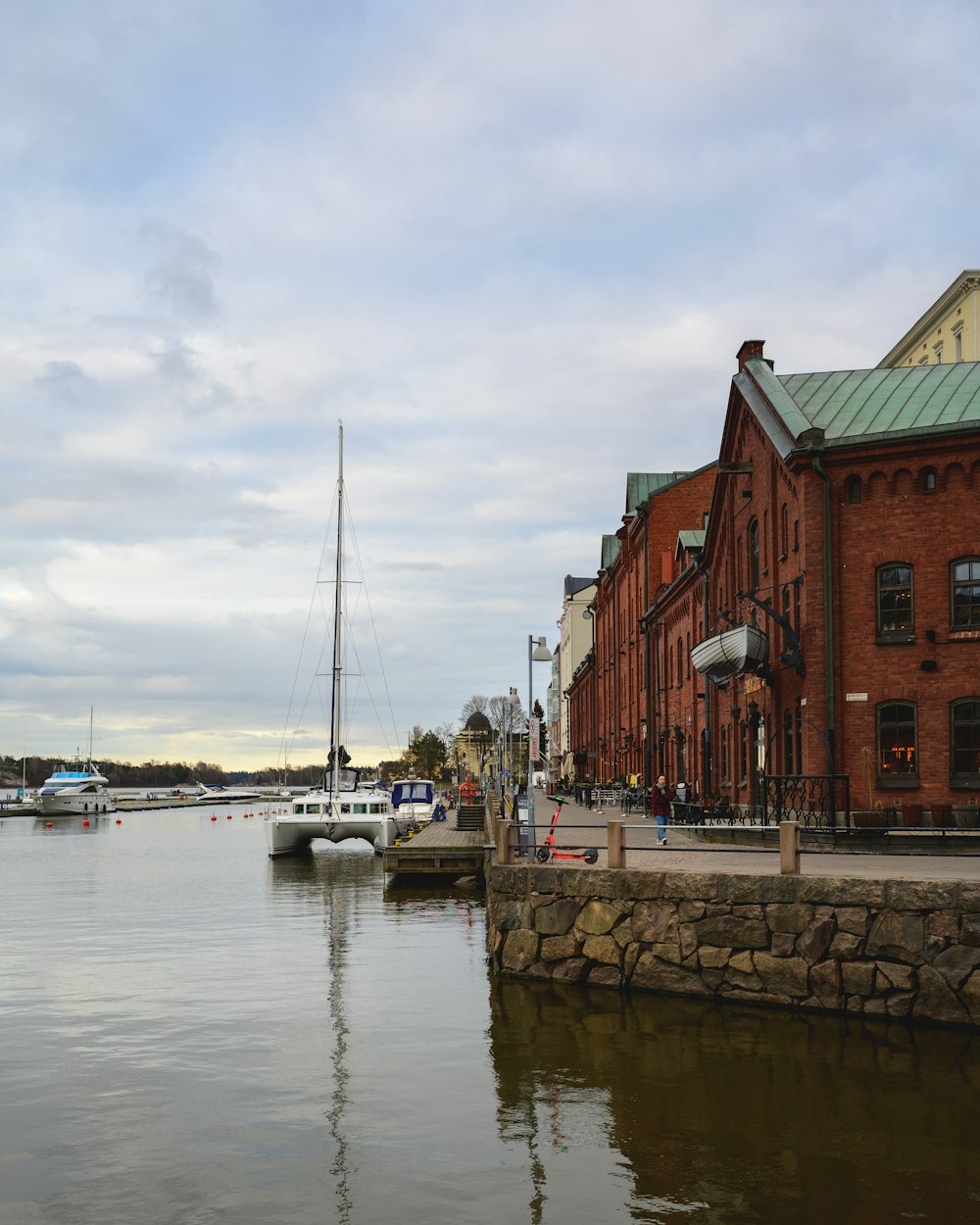 a body of water with boats in it and buildings around it