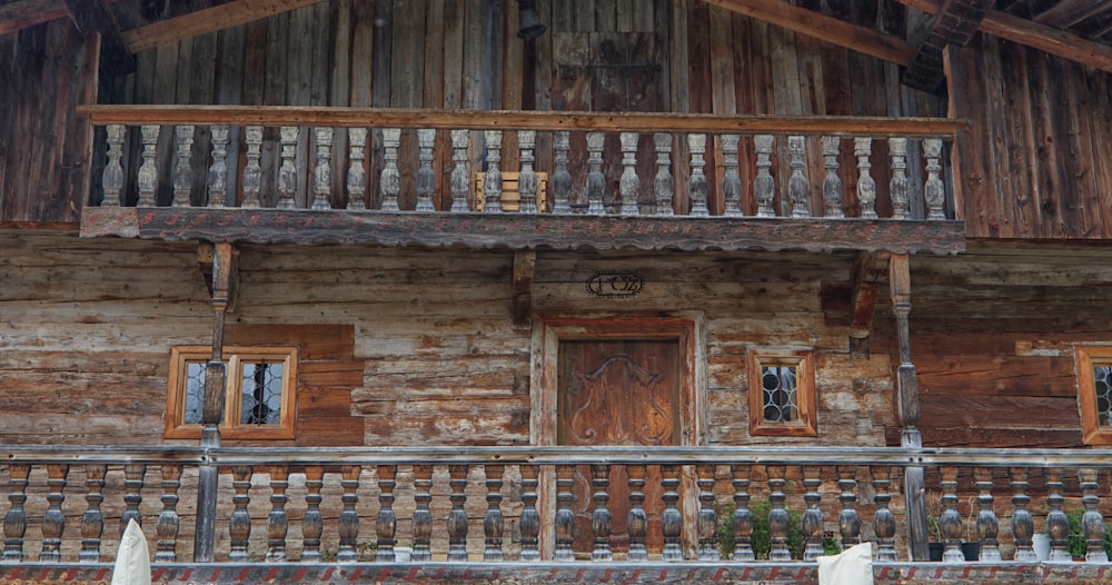 a wooden building with a wood roof