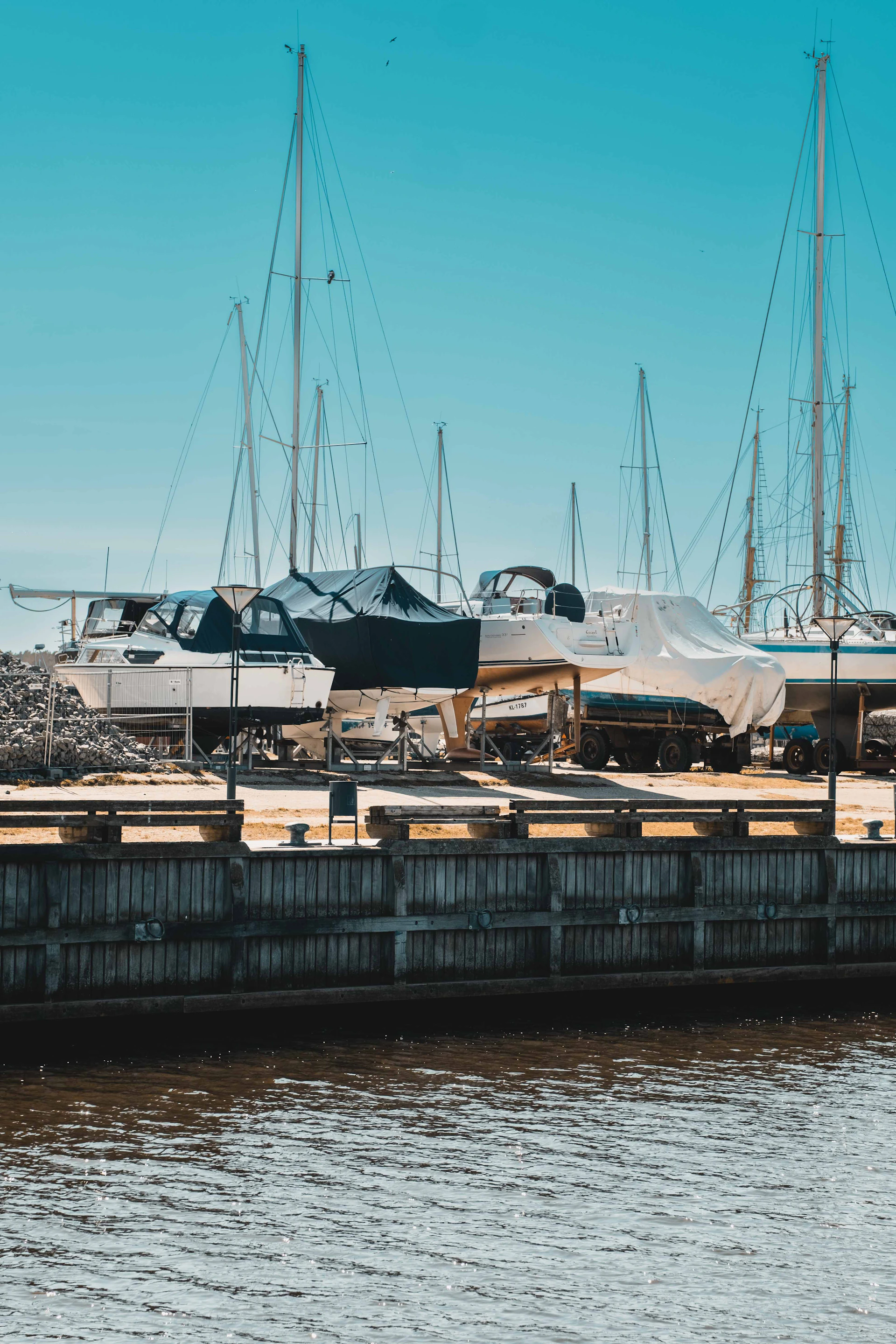 a group of boats docked at a pier