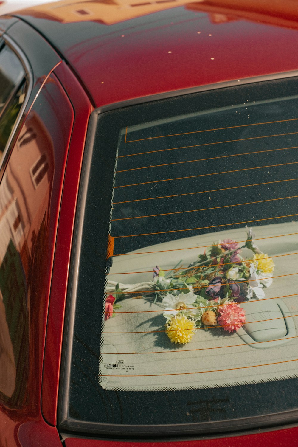 a car with a picture of flowers on the grill