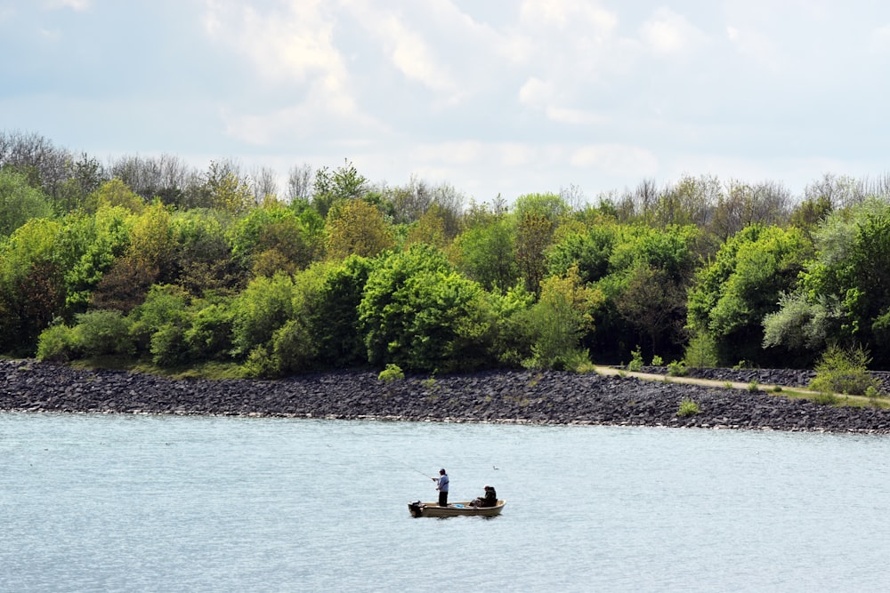 a person on a boat in a lake