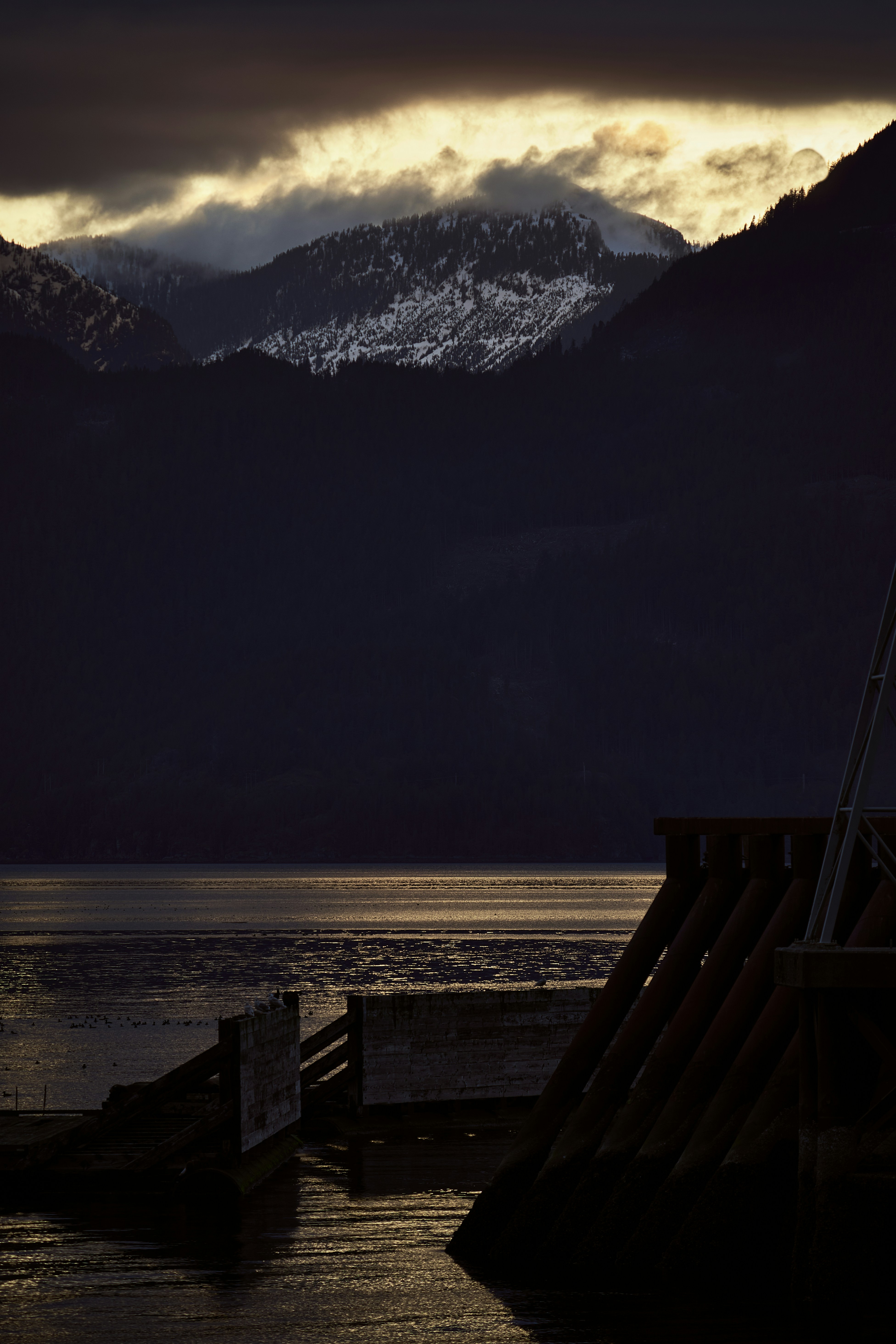 a dock leading to a mountain