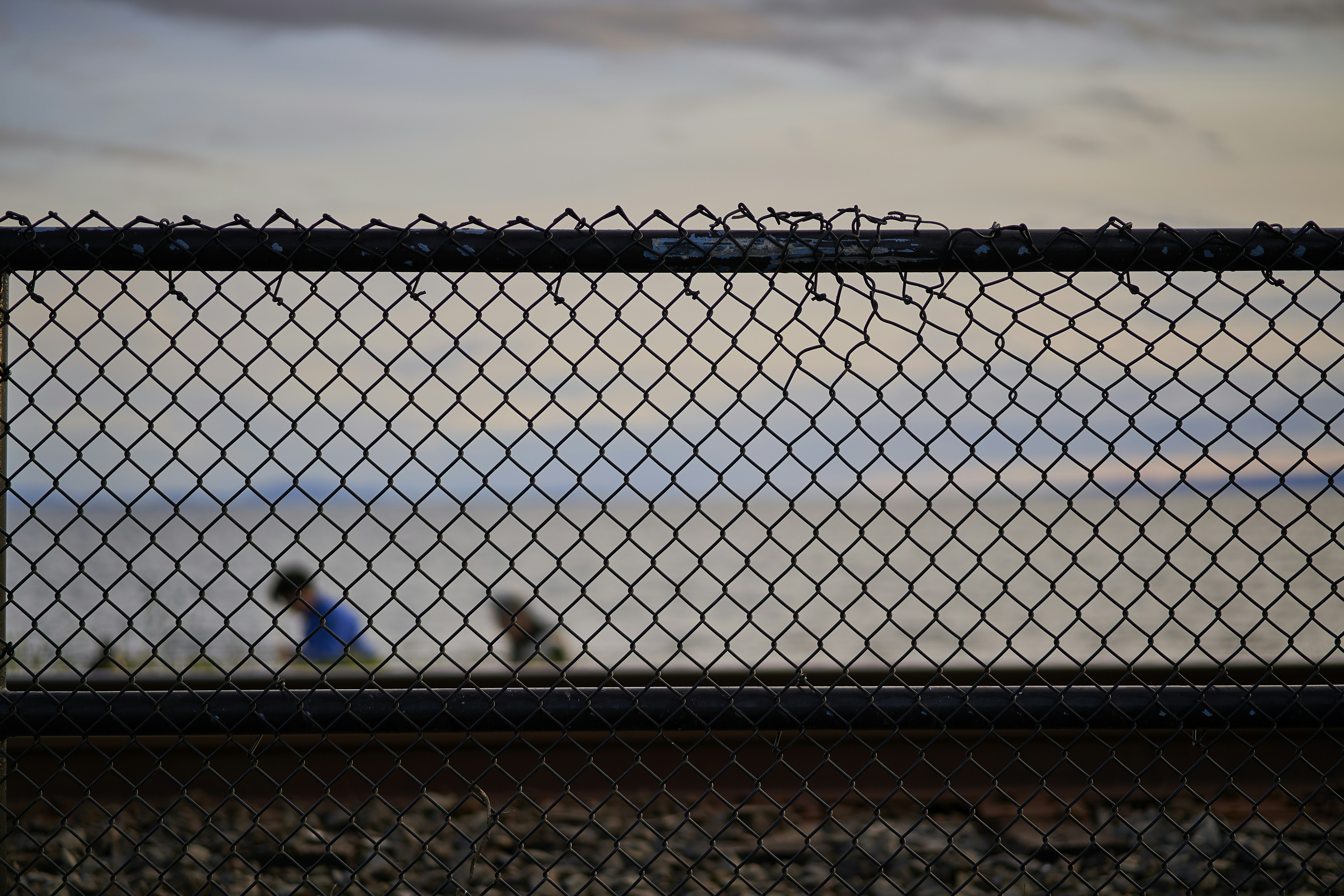 a fence with a chain link fence