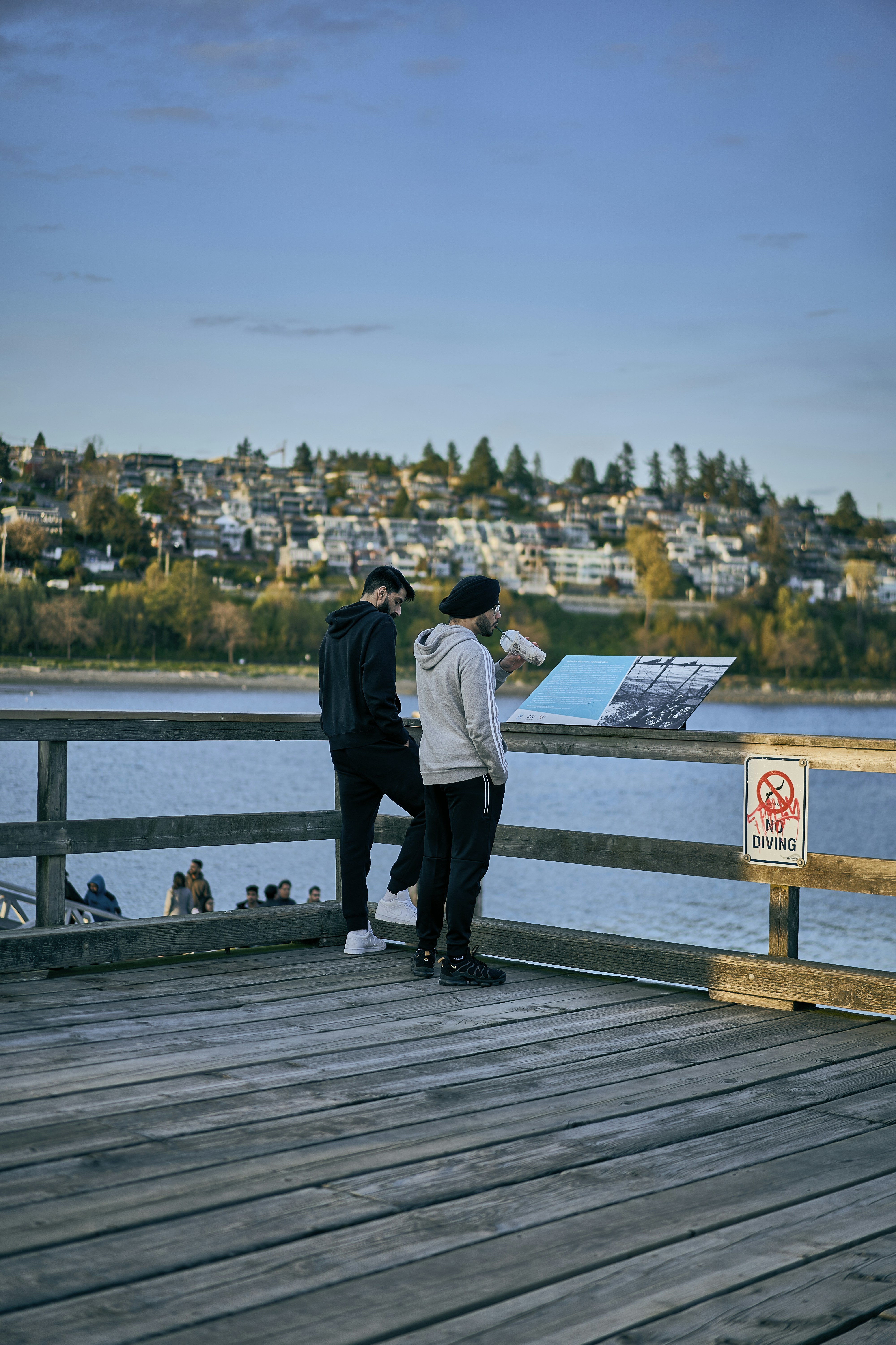 two men standing on a dock