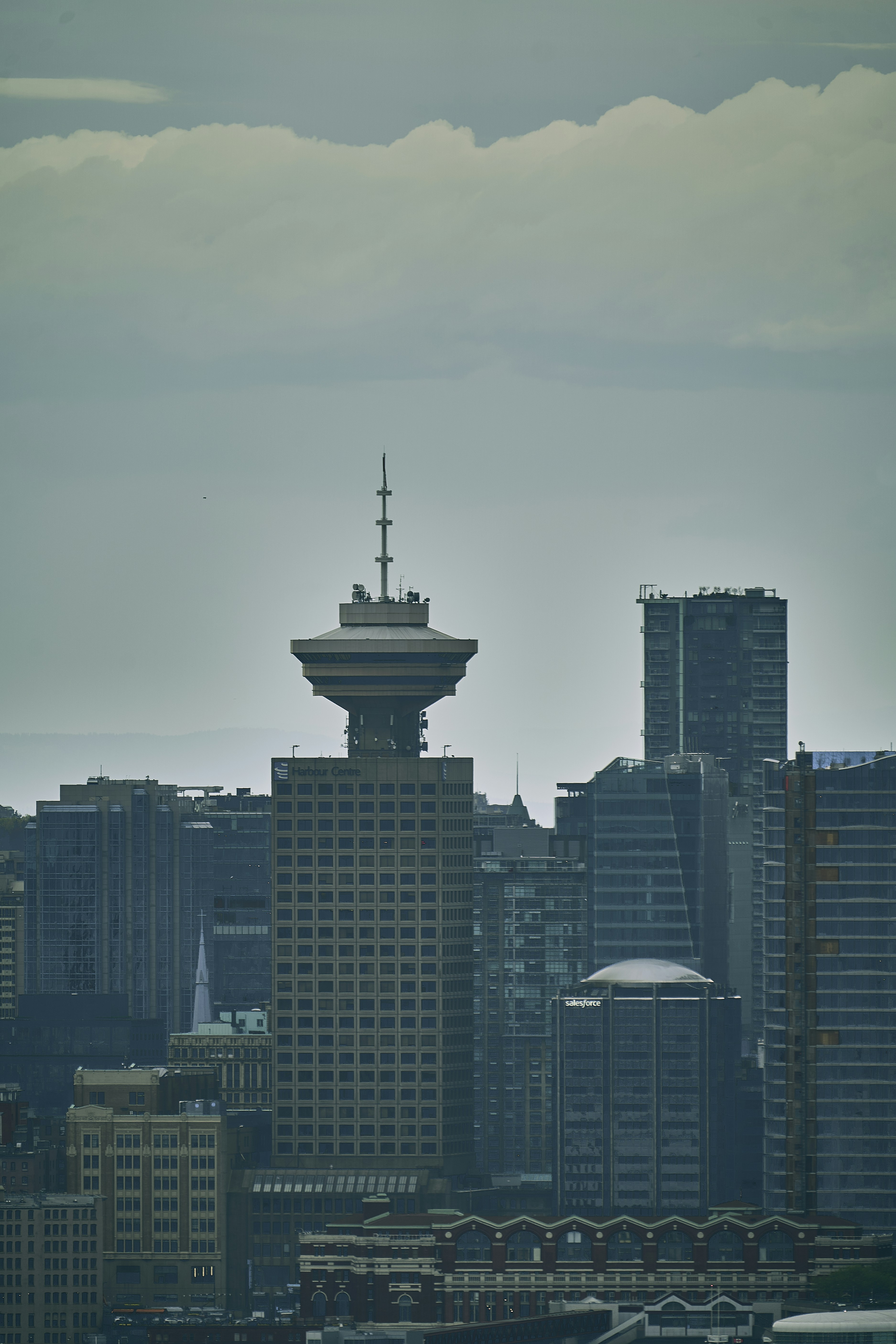 a city skyline with a tall building