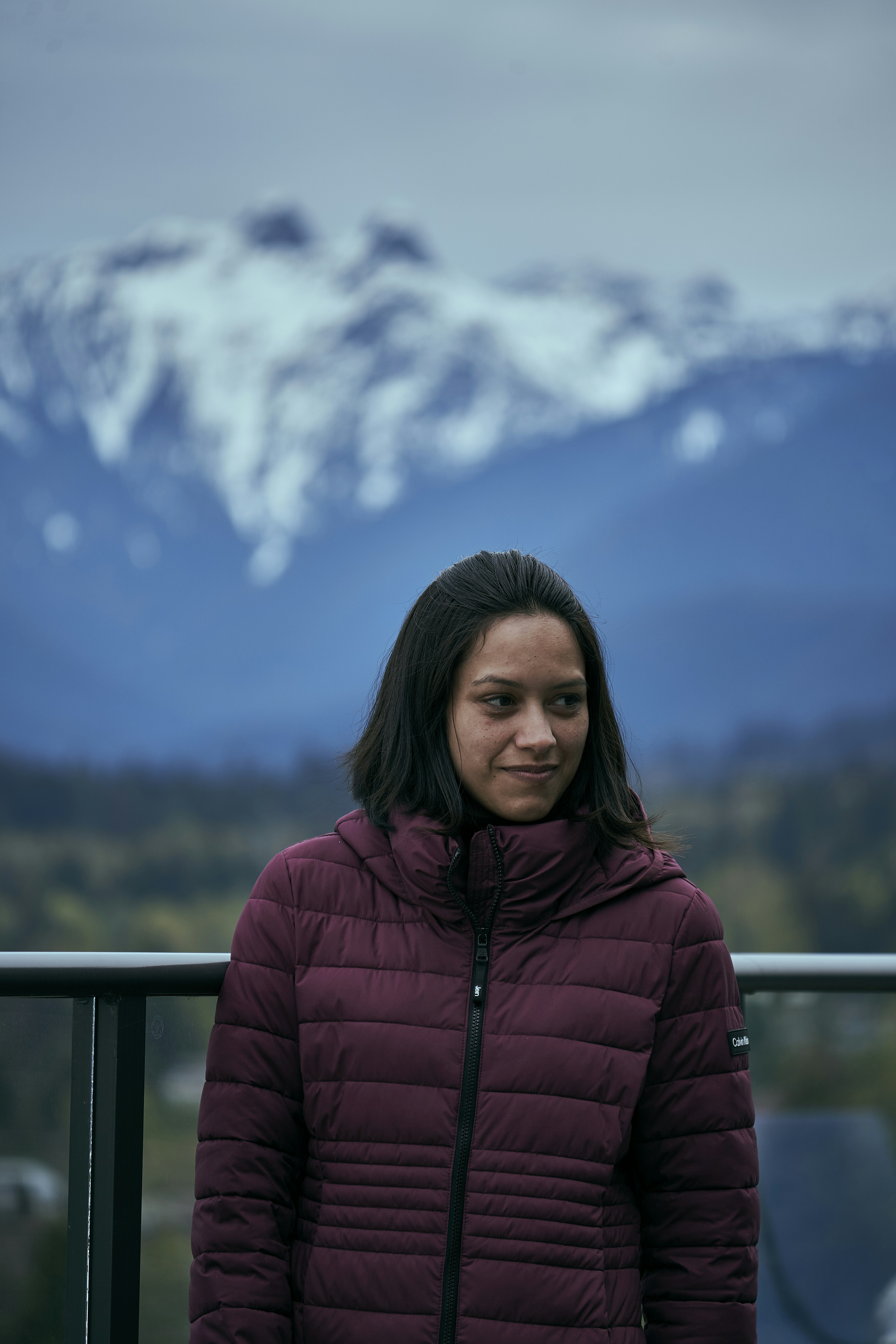a woman standing on a balcony