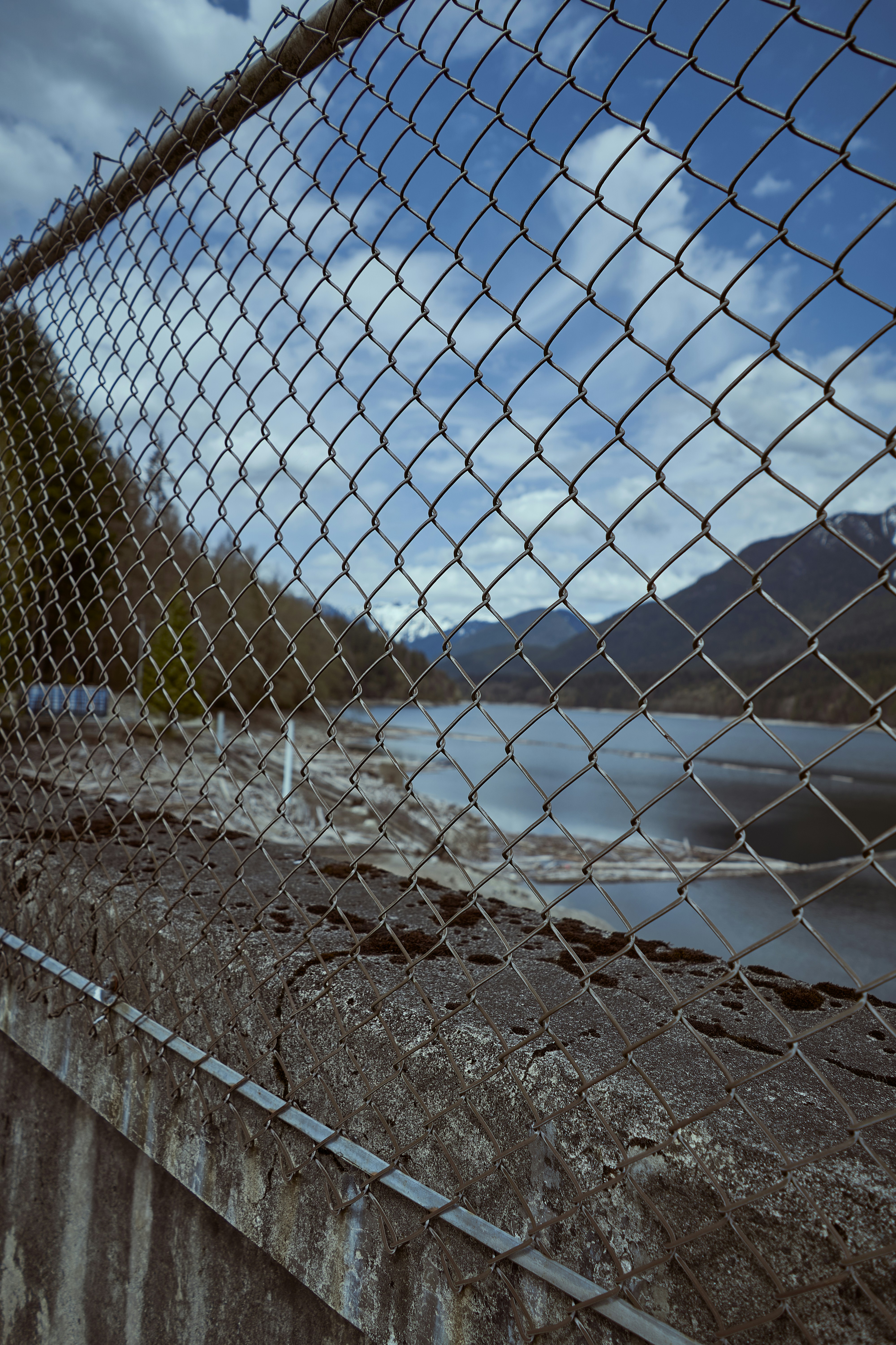 a fence with a mountain in the background