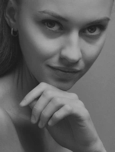 Close-up of a serene individual reflecting healthy lifestyle and longevity.