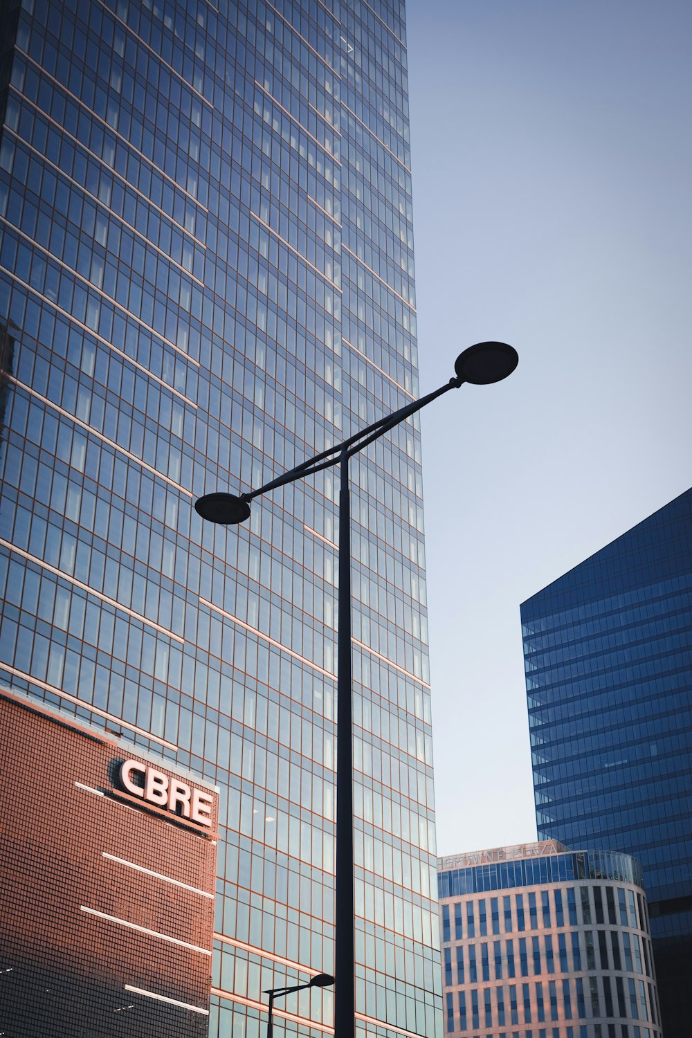 a street light in front of a few skyscrapers