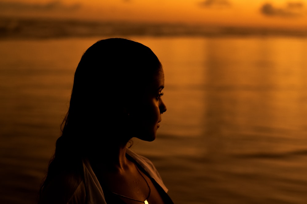 a person looking out over the water