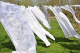 A family happily doing laundry together using breezy clean sheets.