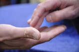 Close-up of hands demonstrating non-verbal communication techniques.