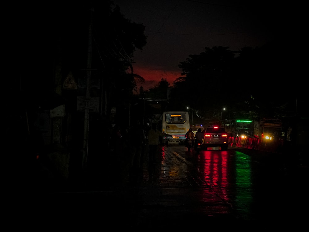 a group of vehicles are parked on the side of a road