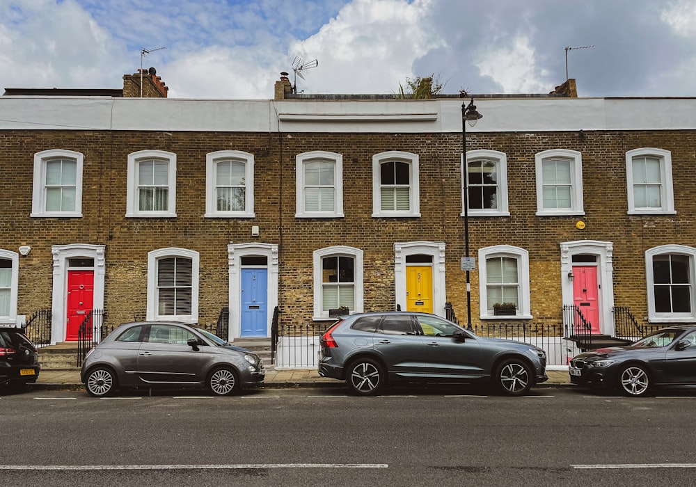 a building with cars parked in front