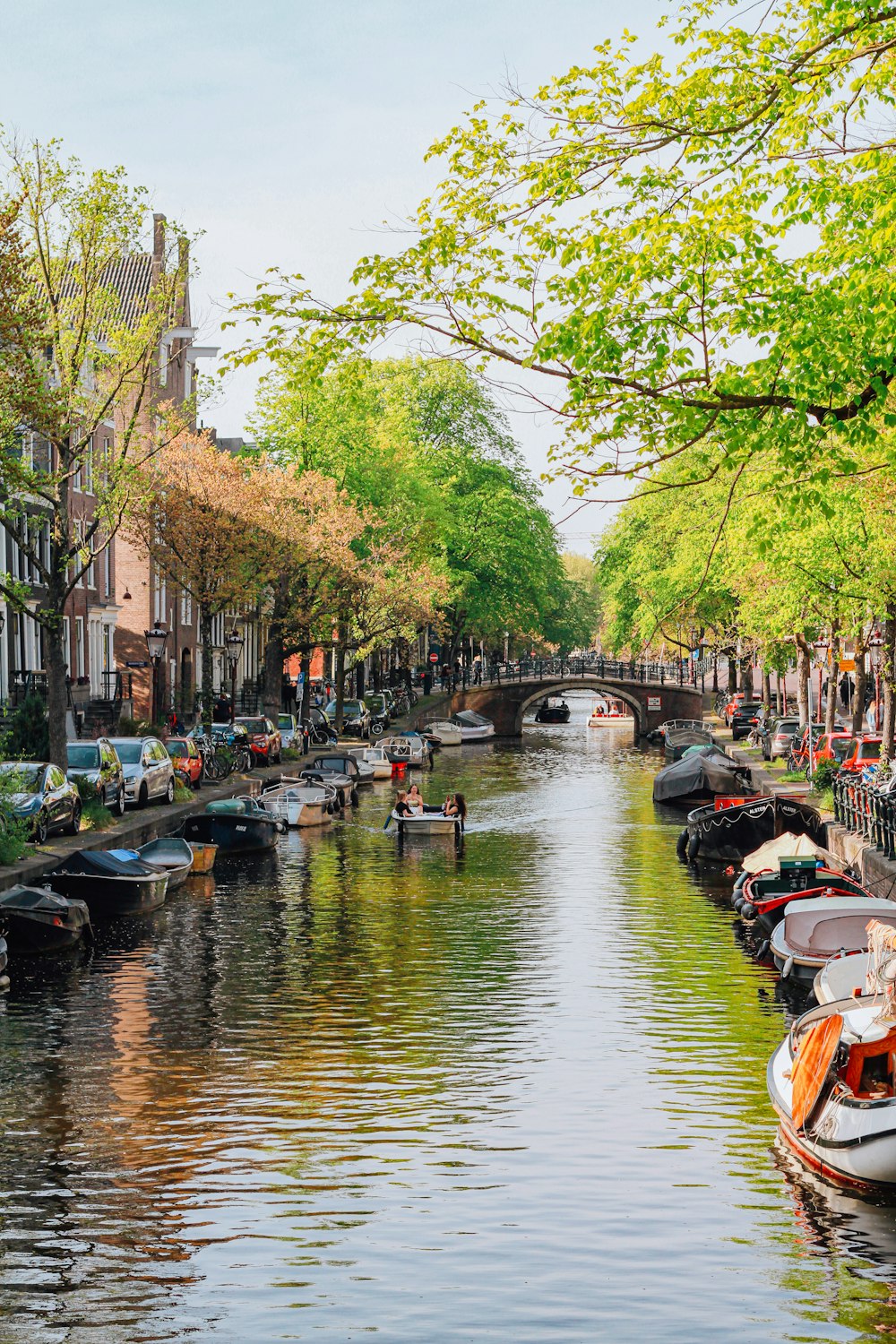 a river with boats and people on it