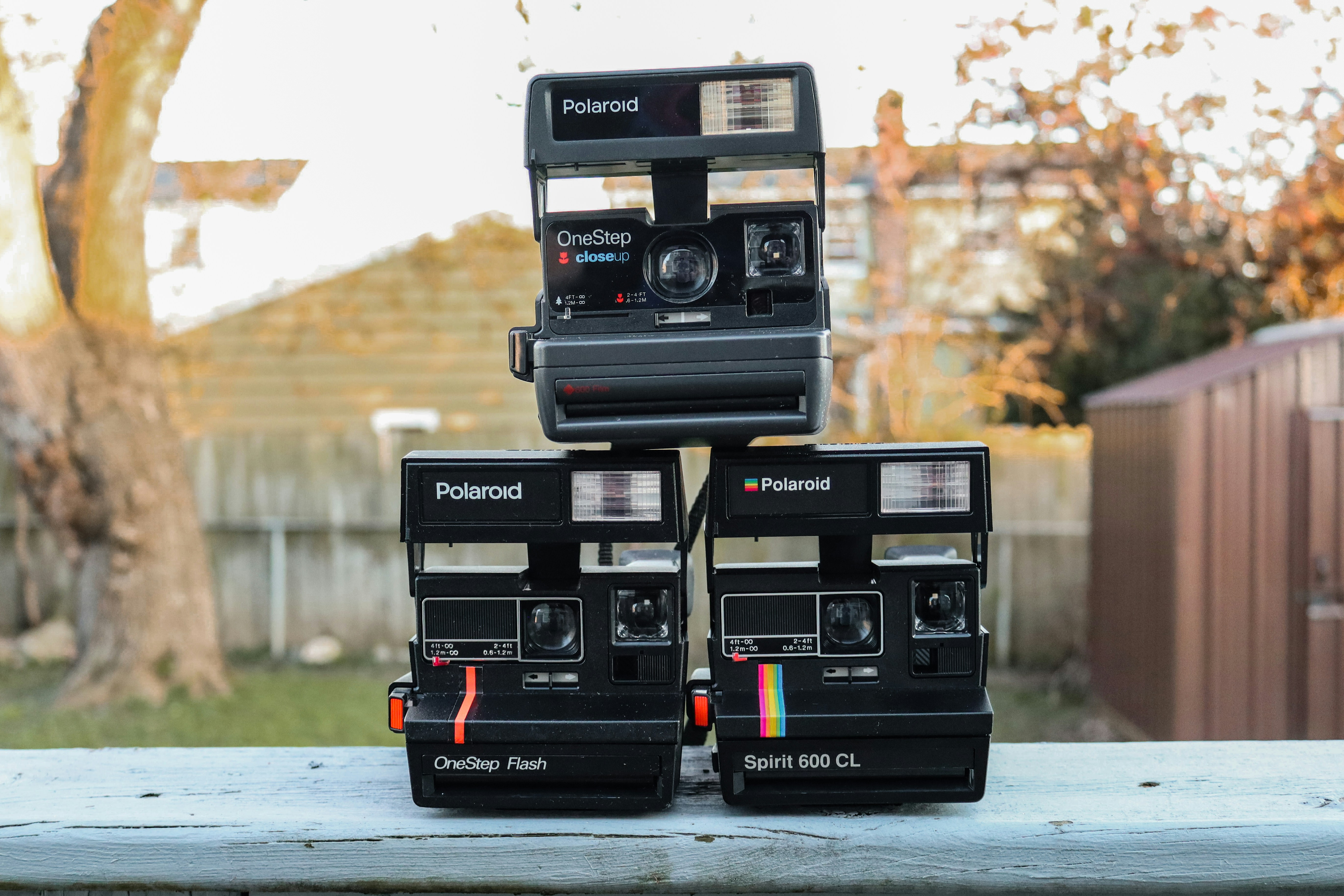 a couple of black rectangular objects with buttons and knobs on a table