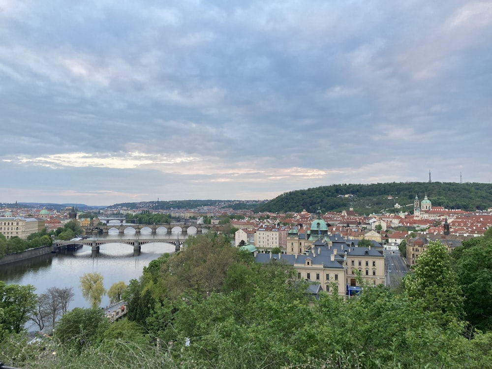 a river with a bridge and buildings