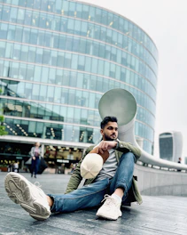 Man wearing a comfortable casual outfit in a bright urban setting