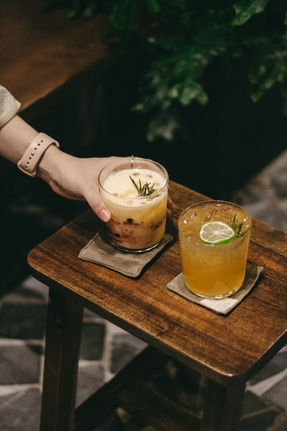 two glasses of liquid on a table