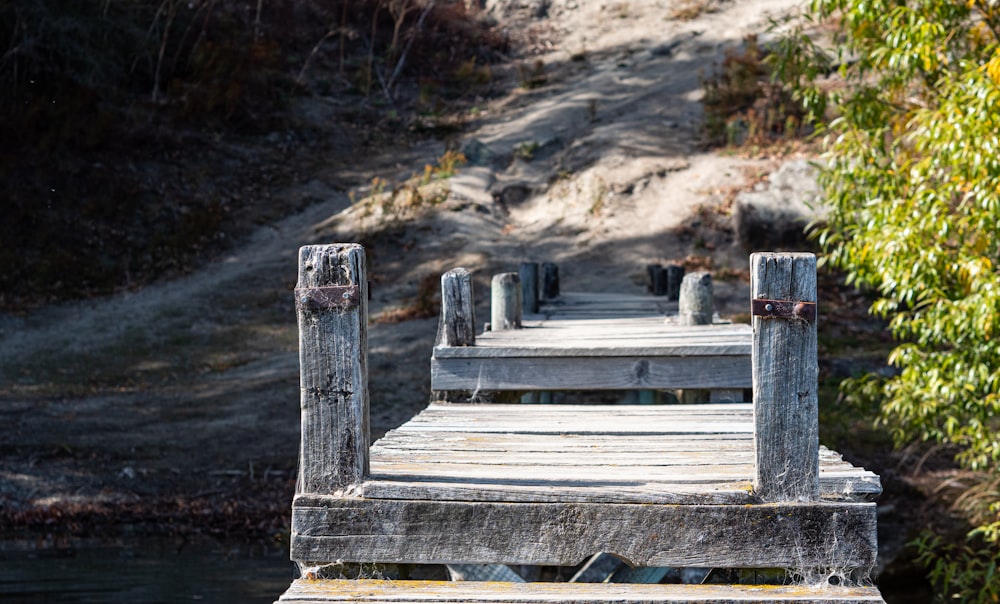 a wooden bridge over a river