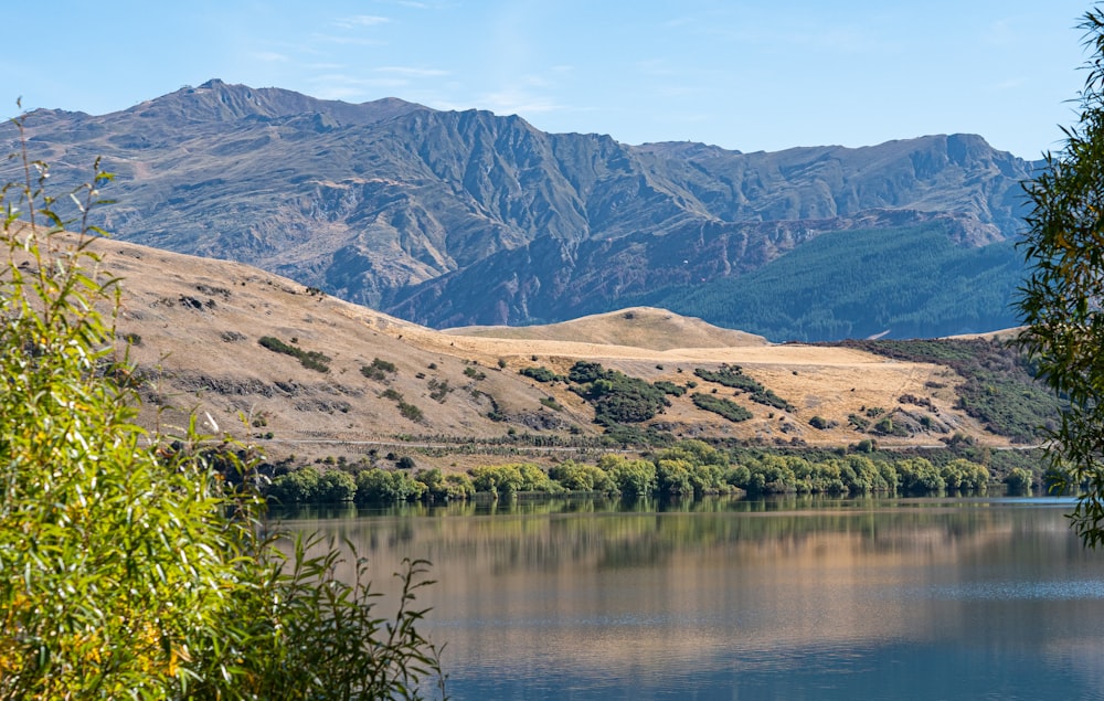 a lake with hills in the background