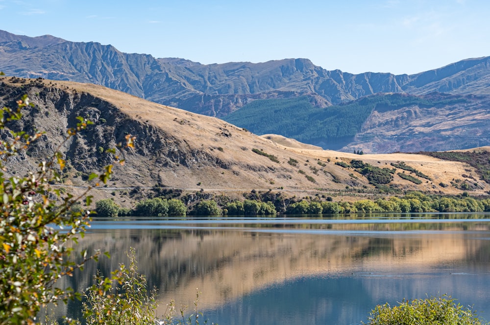 a lake with hills in the background