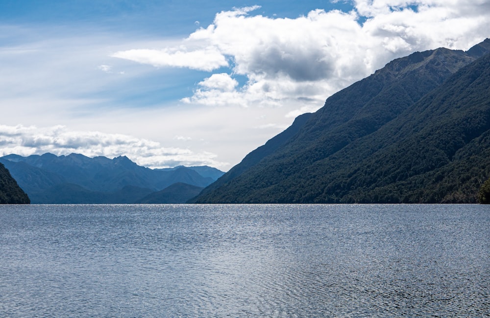 a body of water with mountains in the background with Chilliwack Lake in the background