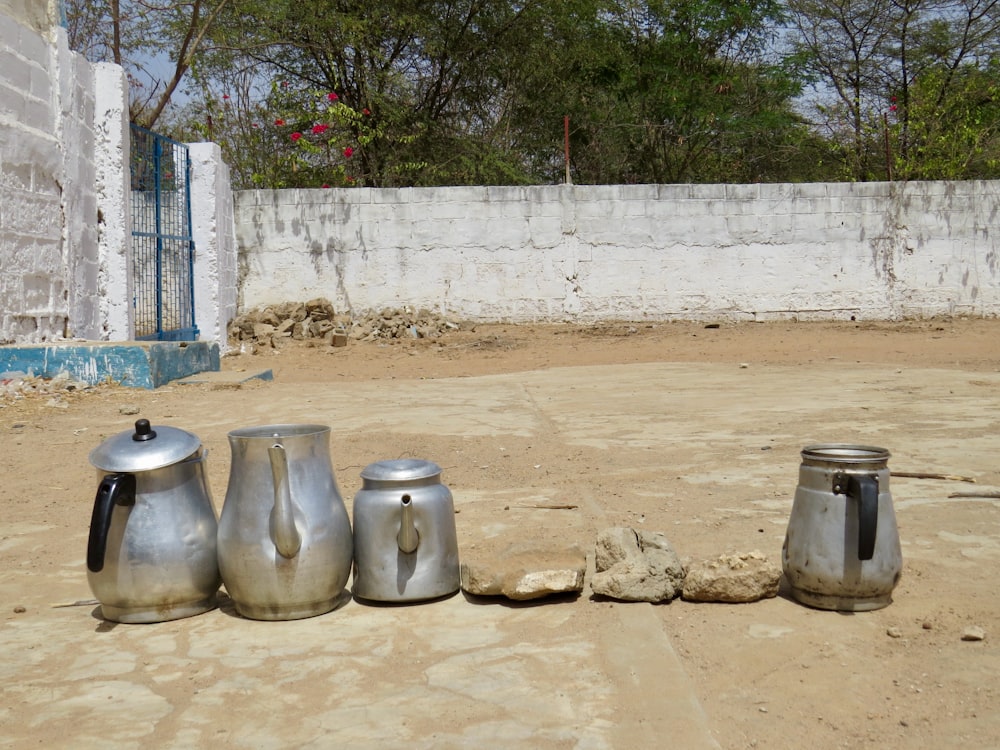 a group of metal containers