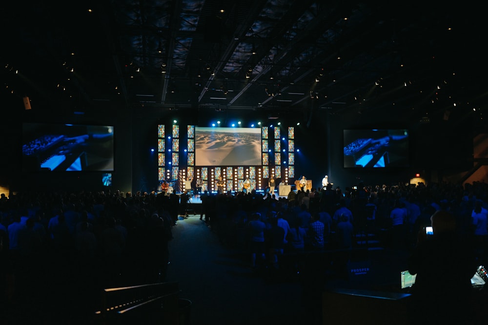 a large crowd of people in a concert hall