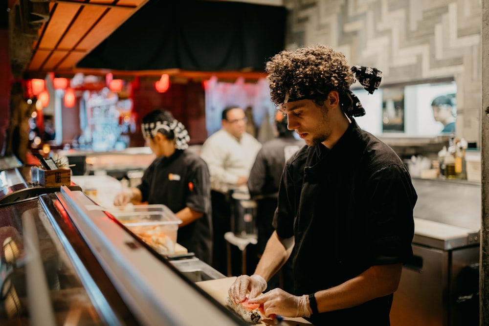 a group of people in a kitchen