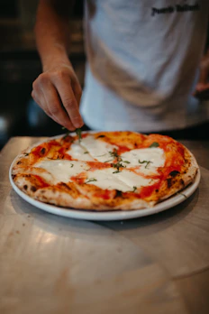 a person is eating a pizza