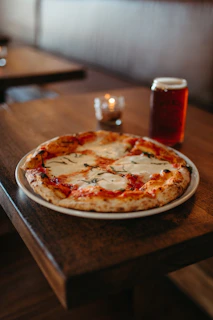 a pizza with a candle on it